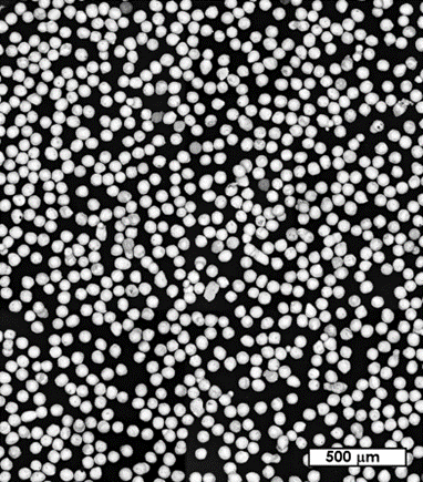 This electron microscope image shows spherical bismuth powder. Each particle in the photo is about the diameter of a human hair (approximately 60 micrometers). 