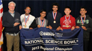 A group of students and teachers holding a banner that reads "National Science Bowl 2013 Regional Champion".