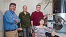 Collaborating scientists (left to right) Eric Stach, Dmitri Zakharov, Anatoly Frenkel, and Yuanyuan Li at a transmission electron microscope (TEM) in the Center for Functional Nanomaterials.