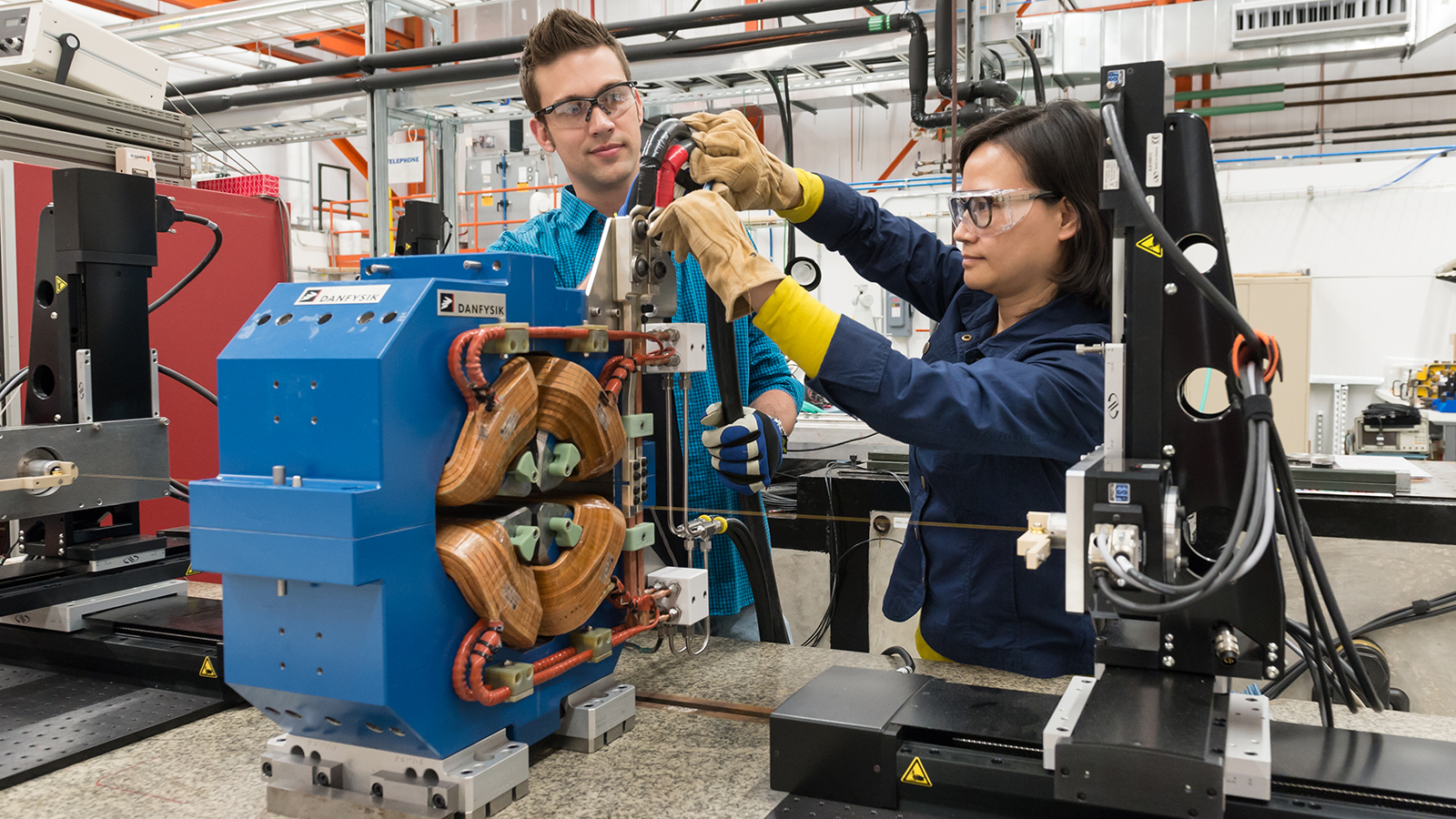 APS employees work to adjust a magnet that will be used in the APS Upgrade. (Image by Argonne National Laboratory.)