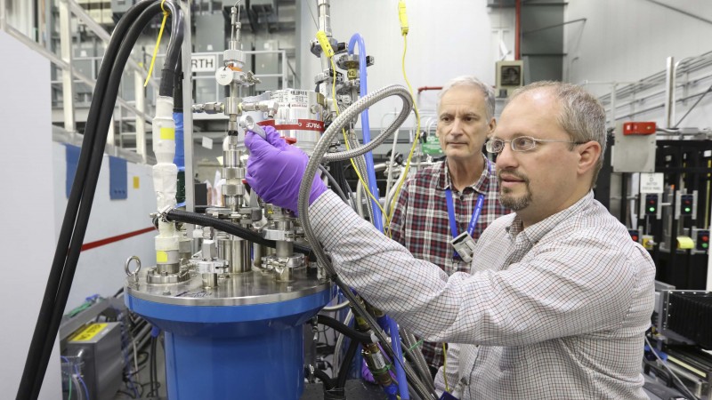 Lund University professor Frederik Ossler (left) and ORNL researcher Charles Finney are using ORNL’s CG-1D instrument to study biomass fuels as they pyrolyze using neutron scattering. Their research could lead to more efficient energy production from biomass. (Image credit: ORNL/Genevieve Martin)
