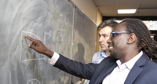 Physicists Ahmed Diallo, front, and Julien Dominski.