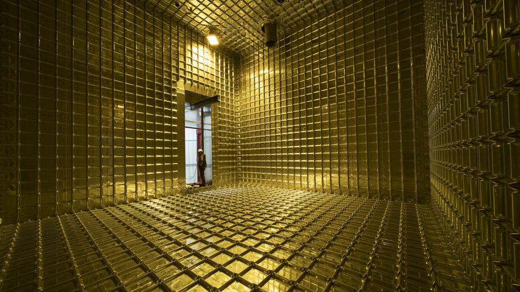 The empty interior of ProtoDUNE takes on a golden hue. Photo: CERN
