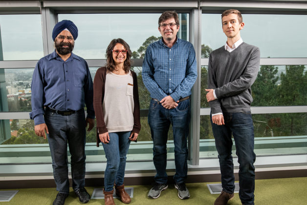 A research team led by Jonathan Ajo-Franklin of Berkeley Lab’s Earth and Environmental Sciences Area (EESA) is turning parts of a 13,000-mile-long “dark fiber” testbed owned by DOE’s ESnet into a highly sensitive seismic activity sensor. L-R: Inder Monga (ESnet), Verónica Rodríguez Tribaldos (EESA), Jonathan Ajo-Franklin, and Nate Lindsey (EESA). (Credit: Paul Mueller/Berkeley Lab)