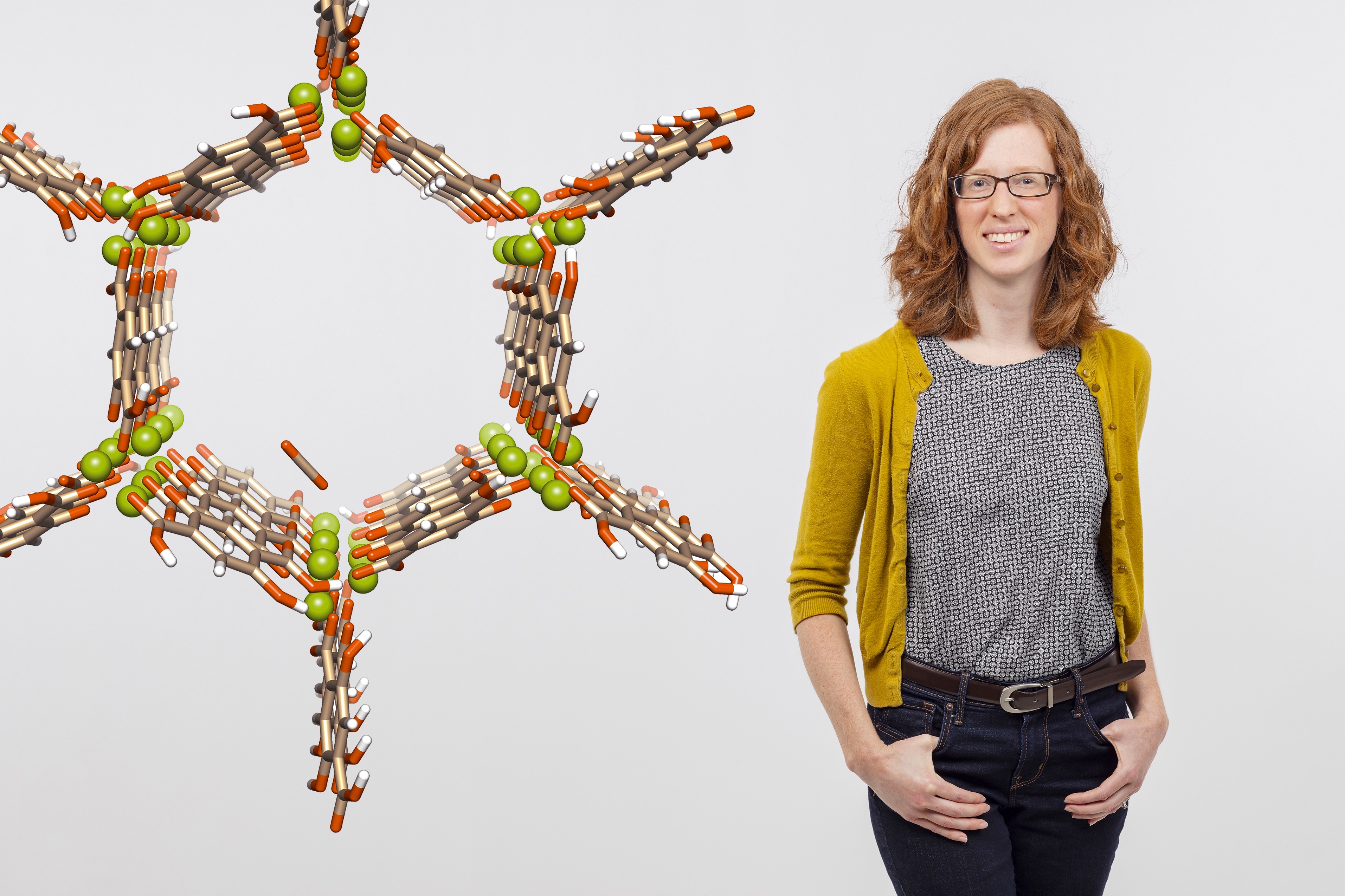 a visualization of a magnesium-based MOF made up of magnesium ions (green) and organic linkers consisting of carbon (tan), oxygen (orange), and hydrogen (white) atoms, and Ashleigh Barnes