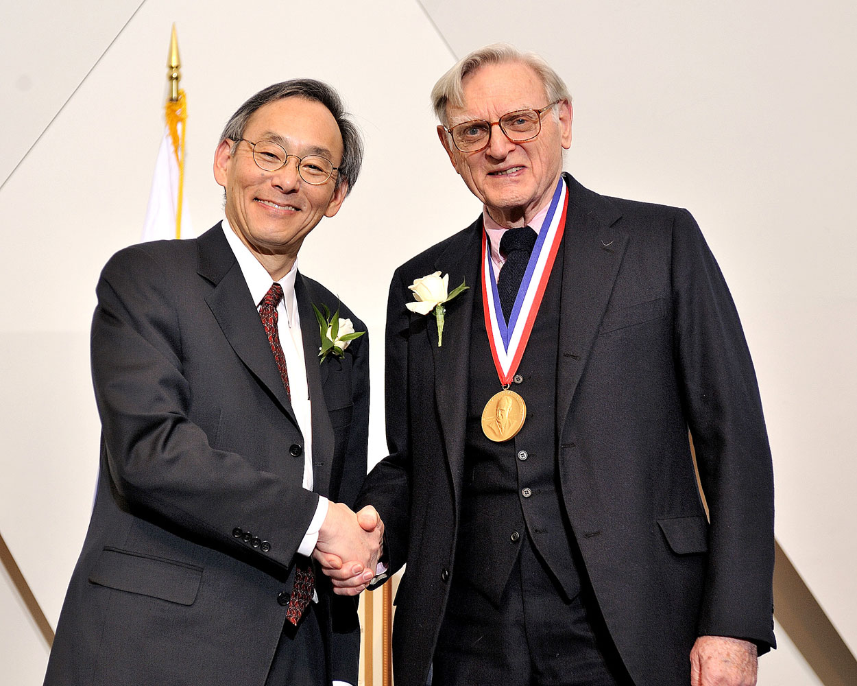 Secretary Chu shaking hands with Dr. Goodenough