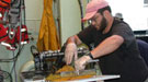 Eisen collecting samples from the back of the Alvin submarine.