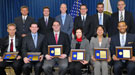 Group of PECASE winners holding their plaques